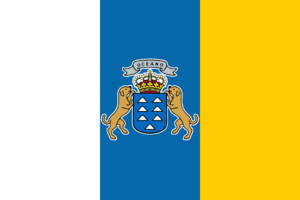 Bandera de Canarias con tres franjas verticales: blanco, azul y amarillo, y escudo central.